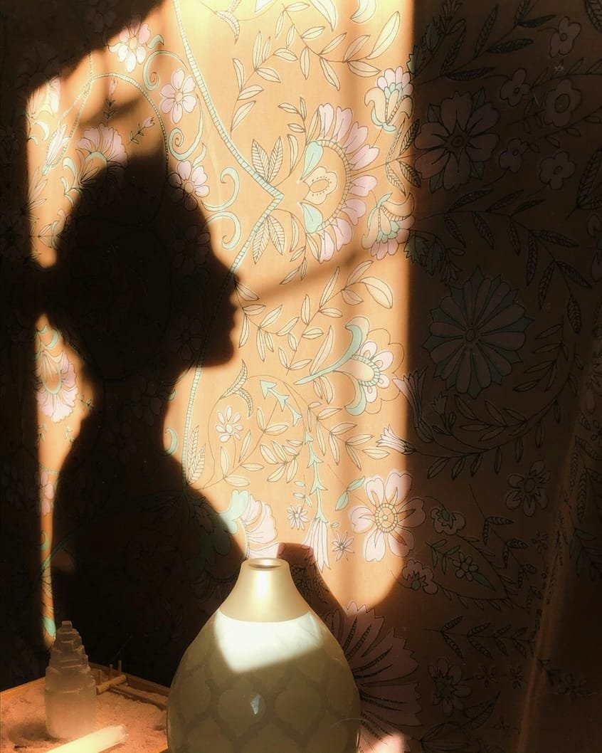 alt="Women seeing her shadow self"